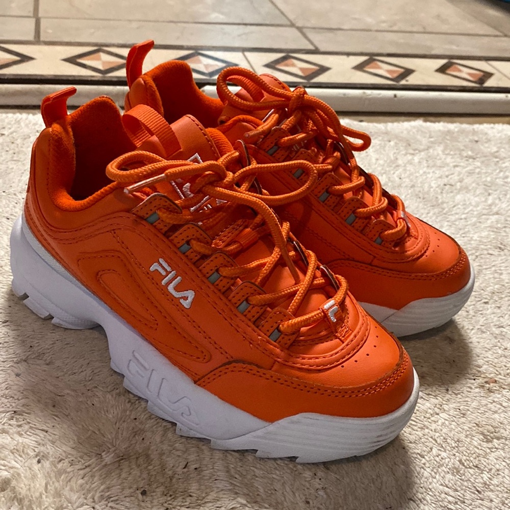 I’m selling just some shoes at the moment, these are some orange Filas.